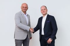 Payward Chief Commercial Officer Mark Greenberg and Saldo Bank President Jarkko Mäensivu.